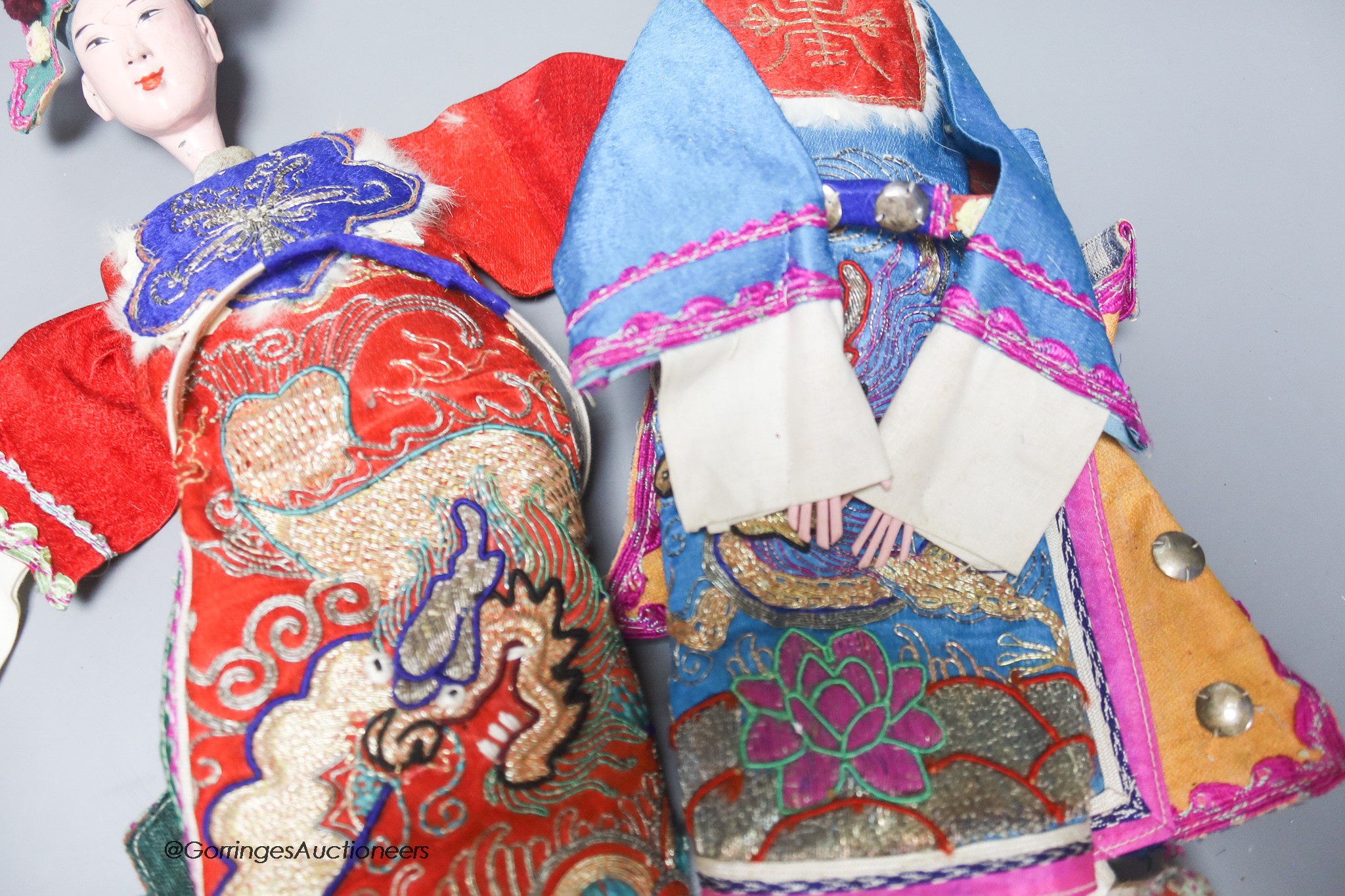 A pair of 20th century Chinese ceremonial dolls